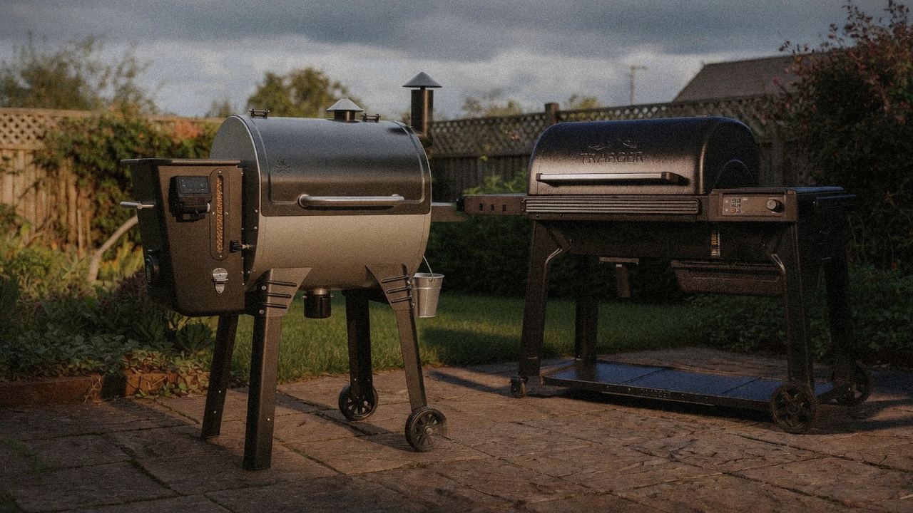 Camp Chef Woodwind WiFi 24 beside Traeger Woodridge Pro, editorial product photography
