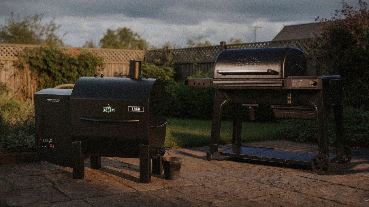Green Mountain Grills Trek beside Traeger Woodridge Pro, editorial product photography