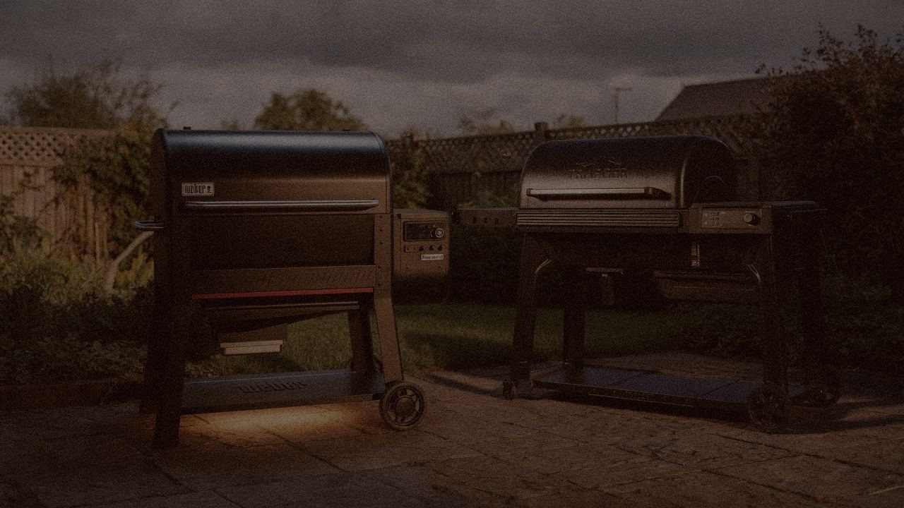 Weber Searwood XL 600 versus Traeger Woodridge Pro on a dusk patio